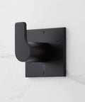 Slick Matte Black Hibiscus Thermostatic Shower System With 1.8 GPM Flow Control wall-mounted control handle detail.