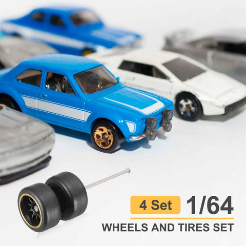 Four Pack 1/64 Scale Wheels And Tires Set With Real Riders Rims Axles Included For RC Diecast Cars And DIY Models next to blue toy car