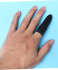 Boss Level Black Antistatic Finger Covers Straight Up Sweat Resistant Cotton Workshop Sleeve Guards on a hand over a blue background.