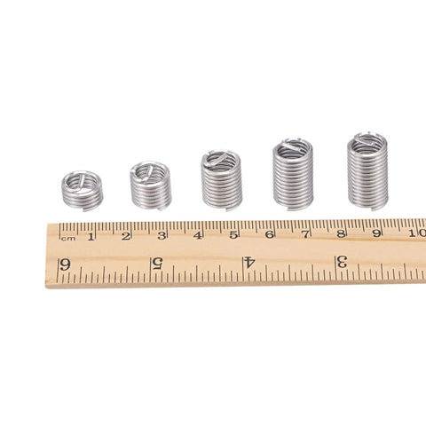 3/8-16 UNC Helical Wire Thread Inserts 304 Stainless Steel Coiled Thread Repair Kit next to a ruler for size reference