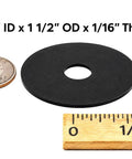 Non Conductive EPDM Rubber Fender Washers 1/4 Inch ID by 1-1/2 Inch OD, 1/16 Inch Thick next to a coin and ruler