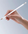 Hand holding Carpenter Marking Pencils Set Pro Grade 10 White Round Pencils With Eraser Non Sharpened Solid Graphite