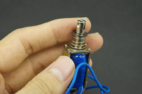 5N 12V DC Push Pull Open Frame Solenoid Electromagnet With Built In Mounting Board Miniature Spring Loaded Actuator For ATM Machines Vending Heavy Duty Industrial Use, close-up in hand