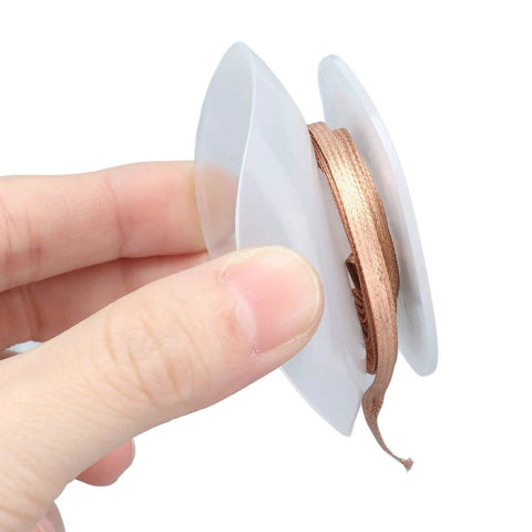 Hand holding No Clean Desoldering Wick Braided Copper Solder Removal Braid For PCB Rework And Electronics Repair, 1.5m Length, 3.0mm Width