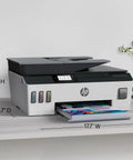 Wireless All-In-One Printer With Refillable Ink Tanks, 2 Years Of Ink Included on a desk with paper tray extended