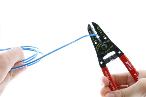 Classic Grip Wire Strippers And Cutters 6.0 Inches For 10-20 AWG Wire, High Carbon Steel Construction, red handles in use on blue wire
