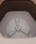 Interior view of the No Sweat Portable Folding Mini Washer Featuring Quick Wash And Spin Cycle, 5.5 Pound Capacity, Slick Khaki Build.