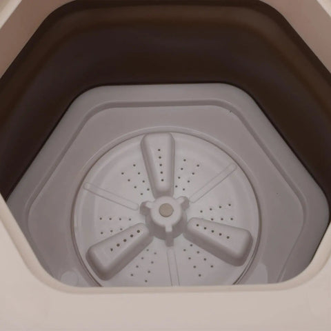 Interior view of the No Sweat Portable Folding Mini Washer Featuring Quick Wash And Spin Cycle, 5.5 Pound Capacity, Slick Khaki Build.