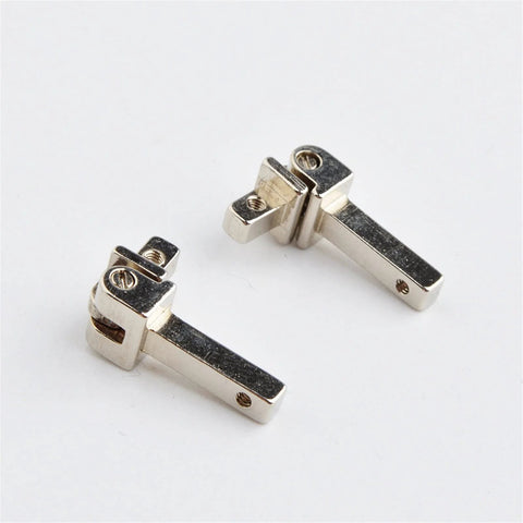 Two silver alloy eyewear hinges for glasses and sunglasses, part of the 10 Sets Replacement Eyewear Hinges For Glasses And Sunglasses With Spring Hinges Alloy Silver Tone Easy Install Non Fading Ergonomic Design Universal Fit Repair Kit For Wide Compatibility And Durable Plastic Frame Eyewear Parts on white background, showcasing easy installation and durable design.