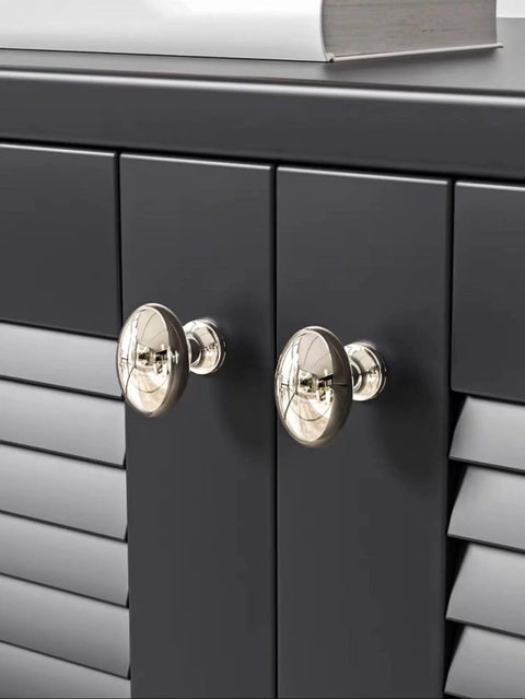 10 Pack Polished Nickel Oval Cabinet Knobs 35 Mm Zinc Drawer Knobs on dark cabinet doors with durable finish and easy mounting.