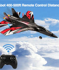 SU27 RC Airplane With 2 Batteries 2.4GHz 6 Axis Gyro Stabilizer flying over clouds with controller in view