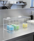 Slick Acrylic Label Organizer With Split Dividers To Keep Ya Organized And Ditch The Clutter Clear Hinged Dispenser Box with colorful tape.