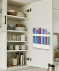 Slick Silicone Straw Holder For Cabinet Door Sturdy Reusable Straw Organizer And Dispenser Bpa Free Kitchen Storage Rack with colorful straws mounted inside a cabinet.