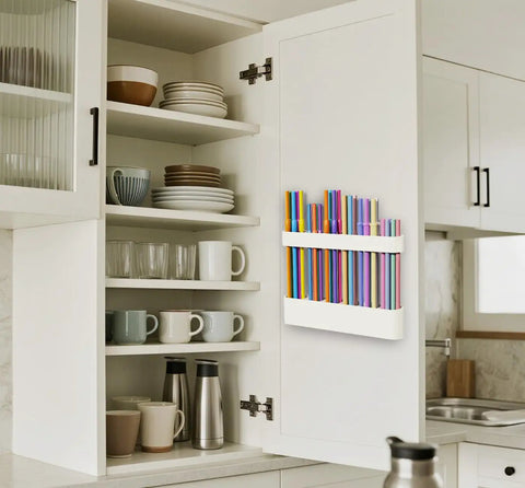 Slick Silicone Straw Holder For Cabinet Door Sturdy Reusable Straw Organizer And Dispenser Bpa Free Kitchen Storage Rack with colorful straws mounted inside a cabinet.