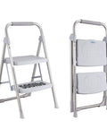 Two Step Stainless Steel Folding Ladder With 500 Pound Capacity Wide Anti Slip Pedals And Beefy Durable Handgrip Lightweight Compact Step Stool For Kitchen Office Home Use Gray, shown open and folded.