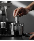 Lock In That Perfect Shot With This 58Mm Magnetic Wdt Tool, Stainless Steel Needle Distributor in use for espresso preparation.