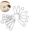 20pcs Stainless Steel Brooch Shape Cotter Pins Quick Lock Spring Safety Fasteners arranged in a star pattern on a table.
