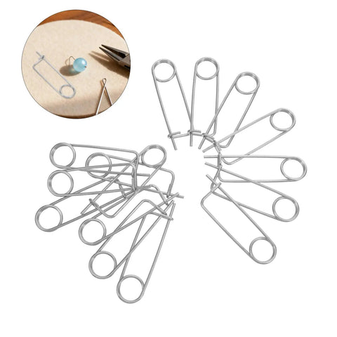 20pcs Stainless Steel Brooch Shape Cotter Pins Quick Lock Spring Safety Fasteners arranged in a star pattern on a table.