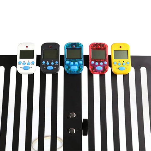 Five Portable Clip On Metronome With LCD Display For Guitar Piano Violin on a music stand, showing various colors and design