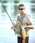 Person holding fish using 60 Piece Fishing Floats Set Hard ABS Push Button Round Buoys For Tackle Accessories One Inch And One And A Half Inch Red