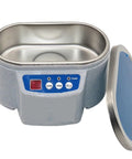 Ultra Portable Ultrasonic Cleaner For Jewels, Glasses, Rings, And Watches with stainless steel interior and control panel.