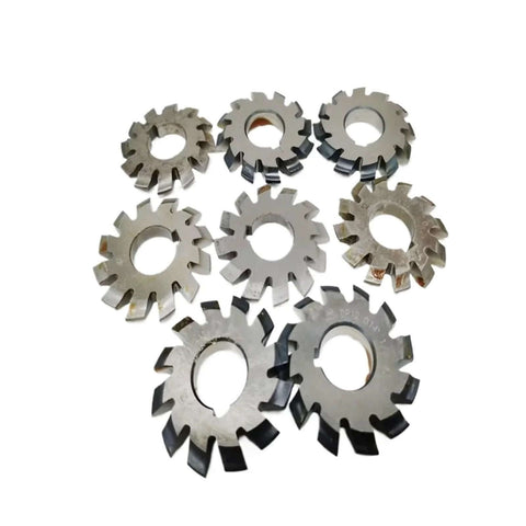 Eight metal gear milling cutter discs with central holes and serrated outer teeth.