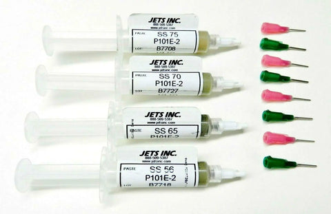 Four syringes labeled with silver solder paste percentages alongside colored tips, for jewelry making and fixes, made in USA.