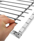 Close-up of Steel Pigeon Cage Door With Secure Lock For Bird Loft Entry Gate being held, showcasing sturdy metal bars and corner hinge.