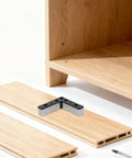 4 Pack L Shaped Aluminum Furniture Legs With Plastic Bases for TV stands near wooden shelf