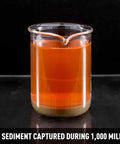 Sample of sediment captured during 1,000 mile road test; orange fluid with particles. Straight Drop In Coolant Filter Kit For Jeep Wrangler JK 2012 To 2018 Keeps Your Rig Clean Blocks Sludge Extends Radiator Life Custom Cut Hoses Slick Black Build Tough Cooling Shield For Street Runs And Trail Adventures.