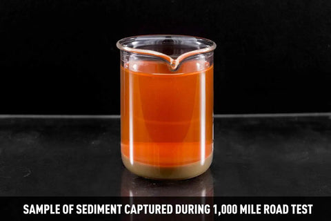 Sample of sediment captured during 1,000 mile road test; orange fluid with particles. Straight Drop In Coolant Filter Kit For Jeep Wrangler JK 2012 To 2018 Keeps Your Rig Clean Blocks Sludge Extends Radiator Life Custom Cut Hoses Slick Black Build Tough Cooling Shield For Street Runs And Trail Adventures.