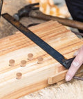 Pro Grade 50 Piece Wood Plug Set for Screw Holes and Carpenter Bee Repair in woodworking setup with khaki plugs and tools.
