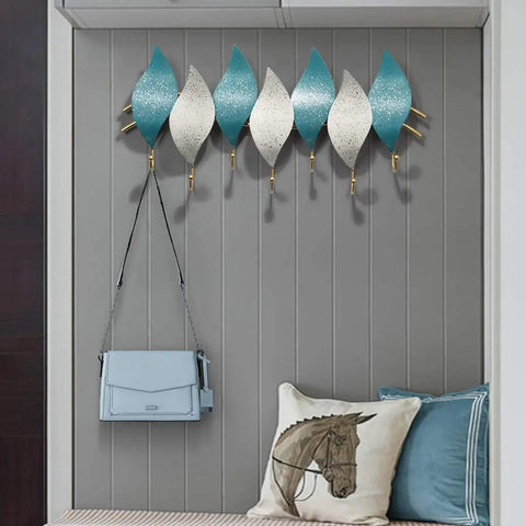 Heavy Duty Wall Mounted Coat Hook With Snowflake Design Iron Wall Hook For Entryway And Bathroom Rust Resistant Metal Hanger For Scarves Umbrellas Bags Keys And Hats Single Unit Silver Finish Home Decor Space Saver, decorative hooks with blue and white leaf patterns.