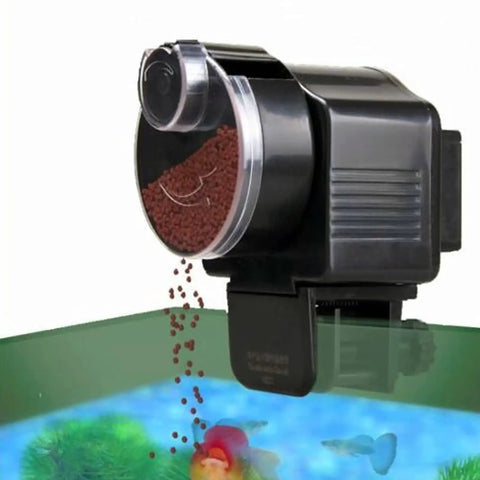 Slick Install Automatic Fish Feeder For Aquarium Battery Operated dispensing pellets, mounted on tank rim with adjustable portion control.