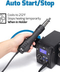 Portable Pro Grade Hot Air Rework Station For Mobile Phone Repair With Digital LED Display held by hand near black unit