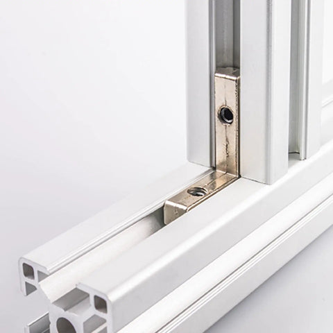 Built Tough L Shape Interior Joint Bracket Set Of Eight Inside Corner Connectors For Aluminum Profile Framing close-up of bracket mounted in aluminum frame.