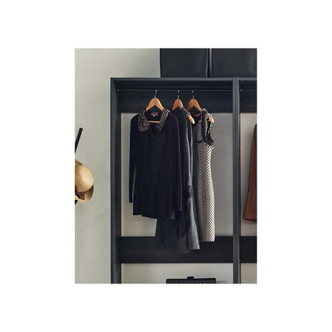 Freestanding Wooden Closet System Featuring Modular Cubbies And Hanging Rods Delivers Totally No Sweat Customizable Wardrobe Storage For Clothes Shoes And Accessories In Sleek Gray with hanging dresses and tops.