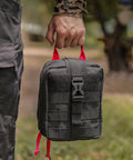 Person holding Multifunctional Camping Waist Pack Lightweight Black Utility Bag For Hiking Survival Gear outdoors