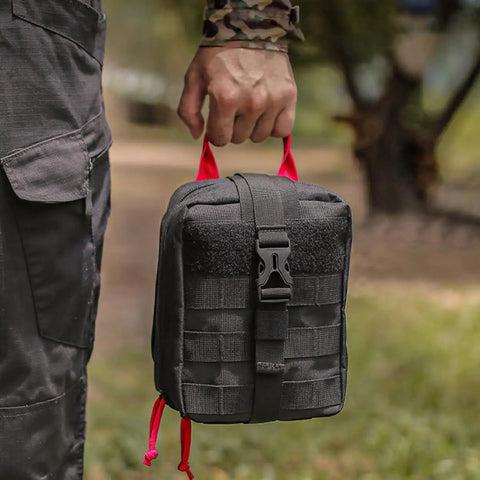 Person holding Multifunctional Camping Waist Pack Lightweight Black Utility Bag For Hiking Survival Gear outdoors