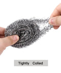 Close-up of Heavy Duty Stainless Steel Scrubber Pads held in hand, showing tightly coiled spiral wire for tough kitchen scrubbing