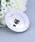 Bathtub Stopper for 40-45mm Holes Stainless Steel with Silicone Seal, round drain cover resting on flowers.