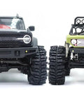 Front view of two RC crawler vehicles with 1.0 Crawler Tires 64x25mm Mud Slingers Super Soft Sticky For RC Crawlers 1 By 18 TRX4M 1 By 24