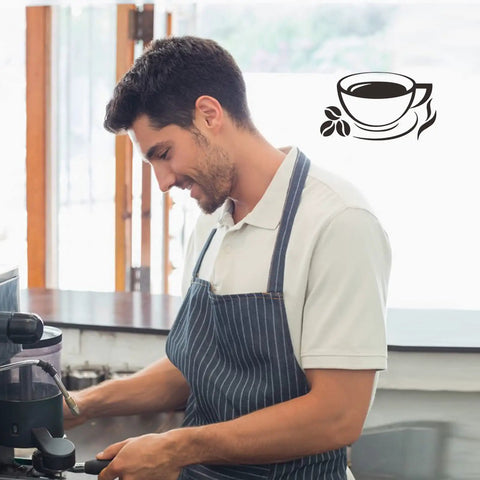 Barista in a coffee shop with a cup decal, highlighting Coffee Signs Wall Decor Sticker Set For Coffee Bar Kitchen Removable DIY Vinyl Decal Wallpaper For Restaurant Home Office Shop Hotel Decoration Easy To Apply Peel And Stick Removable Vinyl Decals For Quick Room Makeover And Cozy Coffee Shop Vibe
