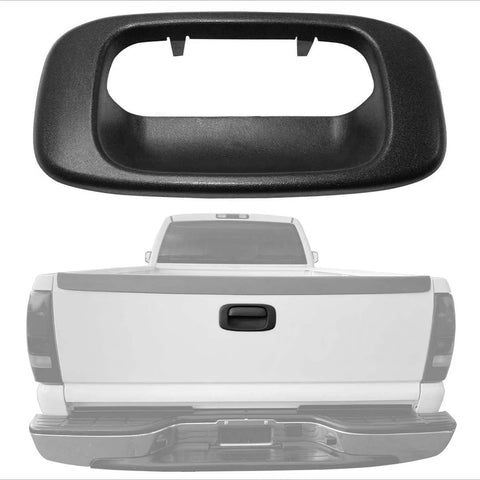 Black textured plastic tailgate handle bezel cover for 1999–2007 Silverado/Sierra; shown close-up and installed on a pickup.