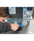 Close up of a Rock Solid Workhorse Portable Magnetic Mill Drill with adjustable base, showing tool adjustment in use.