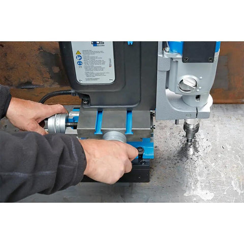 Close up of a Rock Solid Workhorse Portable Magnetic Mill Drill with adjustable base, showing tool adjustment in use.