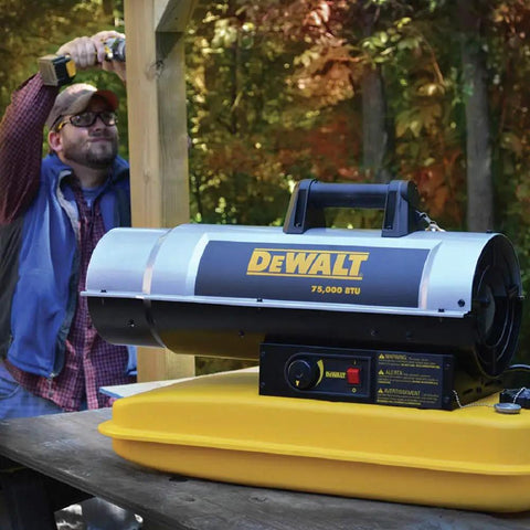 High Output 80000 Btu Forced Air Kerosene And Diesel Portable Heater With Six Gallon Tank on a table in outdoor setting.