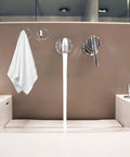 Six Pack Peel And Stick Wall Hooks With Rock Solid Hold For Zero Hassle Bathroom Setup Self Adhesive Hangers For Towels Hats Coats And Everyday Carry holding a white towel on a bathroom wall.