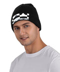 Premium Black And White Piano Plate Grid Knit Beanie Super Soft Winter Hat For Men And Women shown on a model, ideal for cold weather.