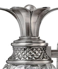 Close-up of Plantation Style One Light Bathroom Vanity Fixture In Polished Antique Nickel With Silver Patina Finish detailing.
